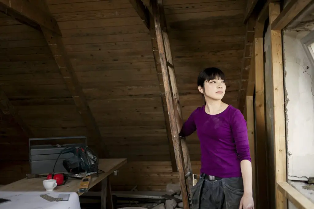 Woman during attic renovation